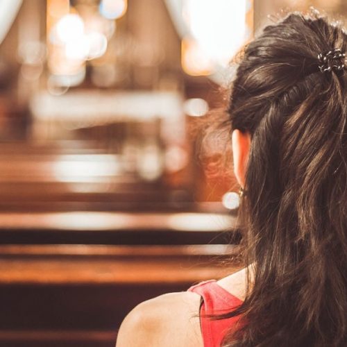 Woman visiting a christian church